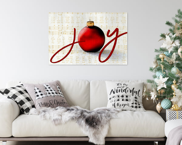 Joy to the World Christmas canvas with elegant script, ornament, and vintage sheet music background in a gold color.