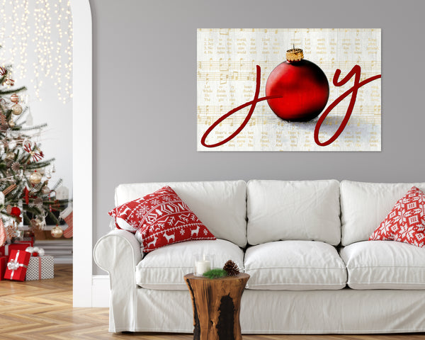 Joy to the World Christmas canvas with elegant script, ornament, and vintage sheet music background in a gold color with a Christmas Tree in the background.