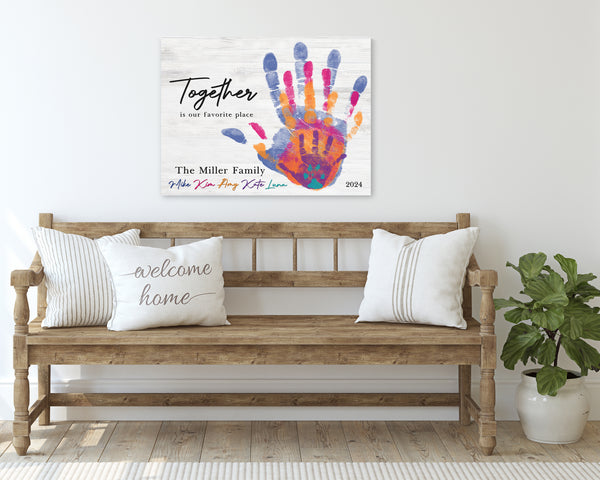 White Wood Family Handprint Canvas on Wall in entry way above bench