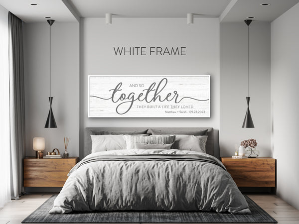 Bedroom with a large wall art piece featuring the text 'And so together they built a life they loved'.