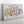 Close up of a custom flower market canvas showing detailed spring flower illustrations on a white wood background. 