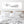 Let's Cuddle' canvas in a white background above headboard in romantic bedroom setting.