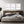 “Let’s Stay Home 3-piece canvas wall art set hanging above bed.